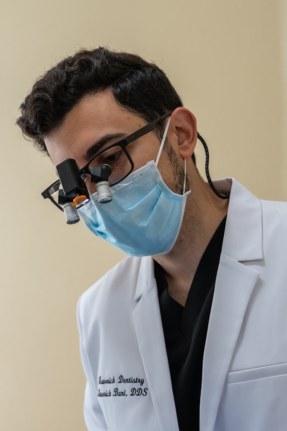 Dr. Maverick Bani wearing surgical loupes